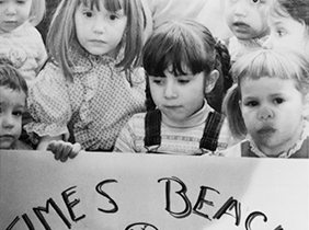 Times Beach, Missouri kids hold sign that says Doomed Without Your Help